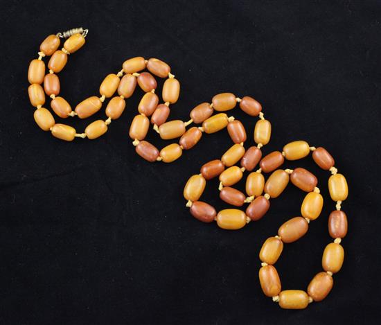 A single strand amber bead necklace, 38in.